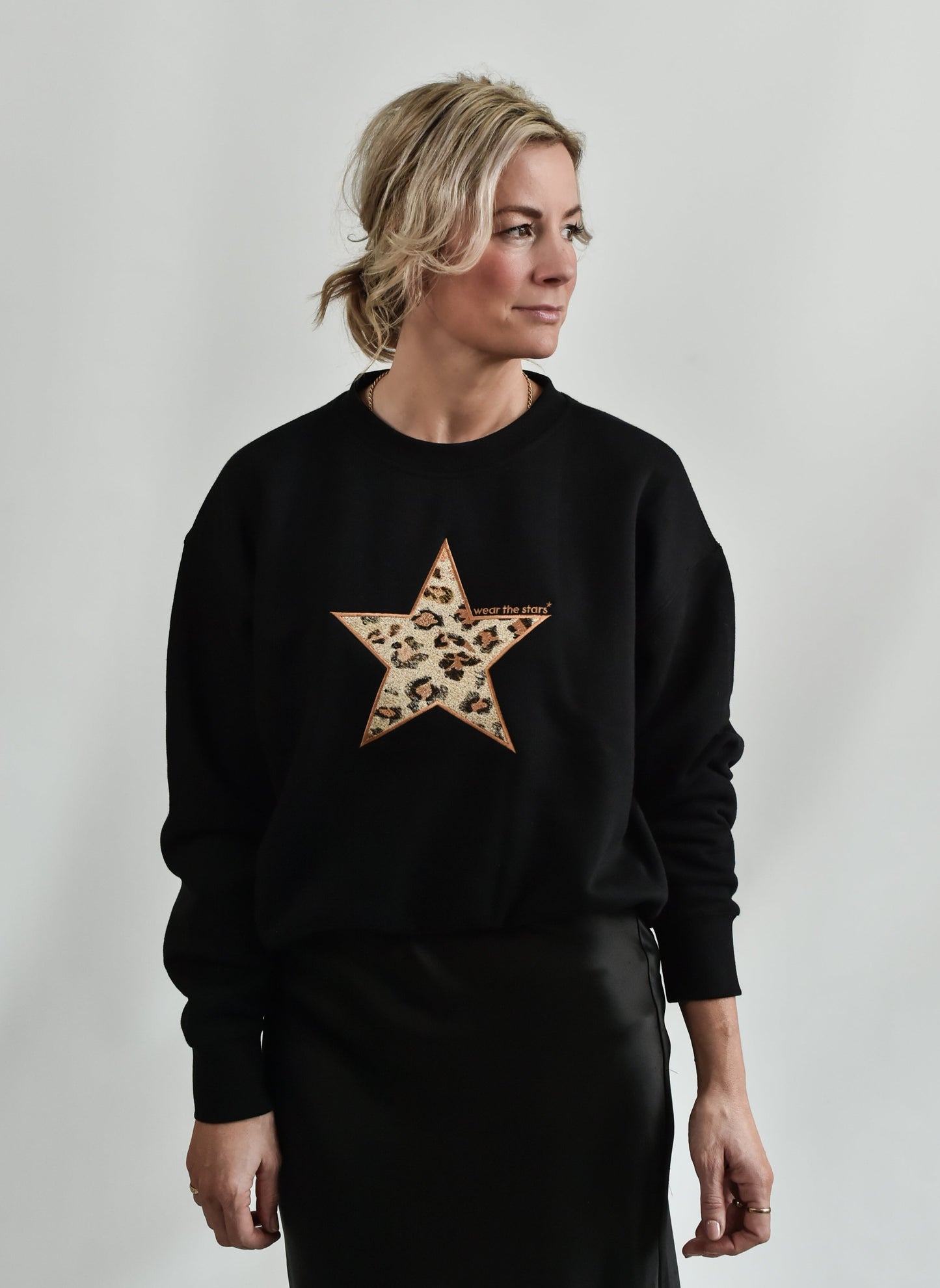 Black sweatshirt with leopard embroidered star